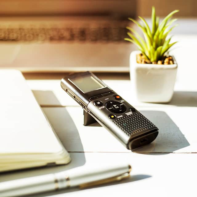 A voice recorder and plenty of notebooks