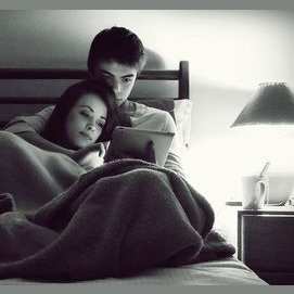 Cuddling and watching TV.