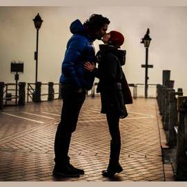 With a kiss.