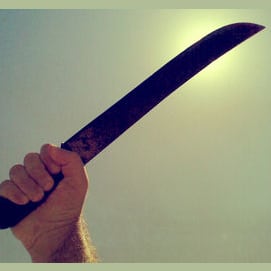 Choose the machete, and pretend to kill the man, and then kill a guard and get his gun to kill the other guards