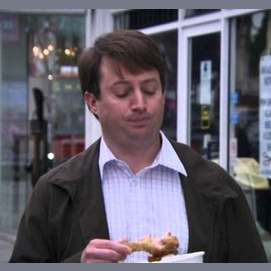 A bucket of fried chicken, eaten like a human horse
