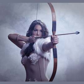 With bow & arrow