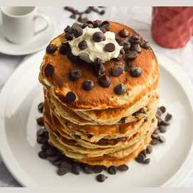 A giant stack of chocolate chip pancakes