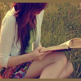 Reading a book about the paranormal.