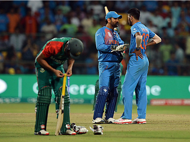 India are on the brin k . Bangladesh require two off the final three balls, but they lose their two set batsmen off consecutive deliveries. Two to defend. No. 9 on strike, with No. 10 for company. MSD has one glove off to be more prepared to effect a run-out in case the batsmen try to take a bye to tie the game. Hardik Pandya bowls it outside off, and Shuvagata Hom can't reach it. Dhoni charges in and breaks the stumps, Mustafizur Rahman is caught short. 