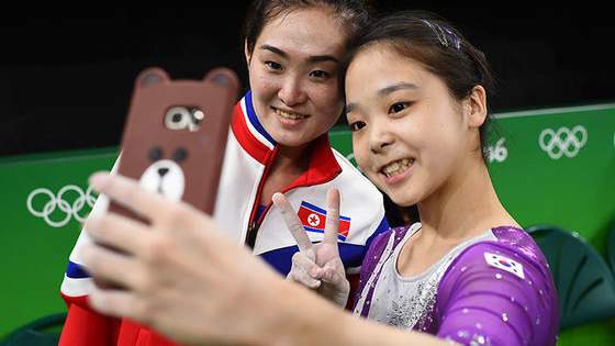 North and South Korea are technically still at War, but even War can wait for the uneven bars.