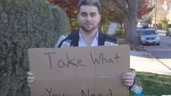 Coby Persin wore a money suit and held a sign saying "Take What You Need". What he saw will stun you. 