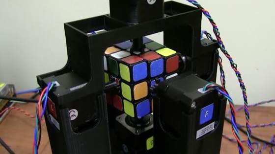 The device uses an insane algorithm to magically solve the popular toy puzzle. 