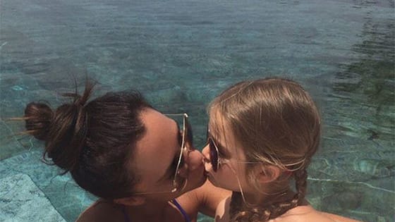 When Victoria Beckham posted a photo online of her kissing her daughter, Harper, on the lips, it sparked an age-old controversy: Is it weird to kiss your kids on the mouth? But these parents are defending Beckham by posting photos of their own!
