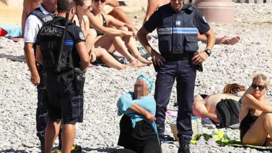 A new French law just passed banned the Burkini, and Police are enforcing that law