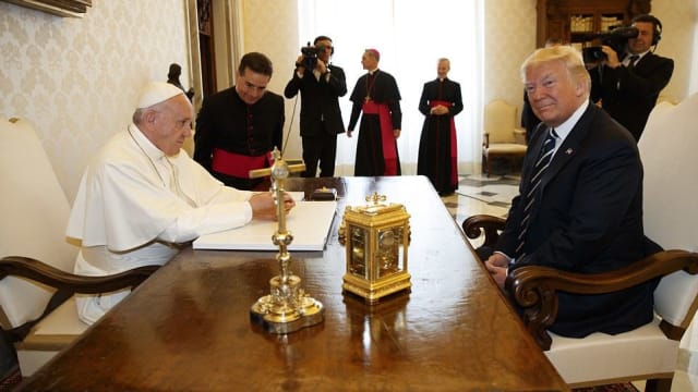 President Donald Trump visits the Vatican to meet with Pope Francis and is urged to be an 'olive tree for peace.'