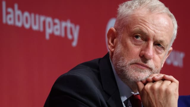 Labour leader called on the UK Government to halt the roll-out of its flagship welfare reform "before millions of people are made worse off".