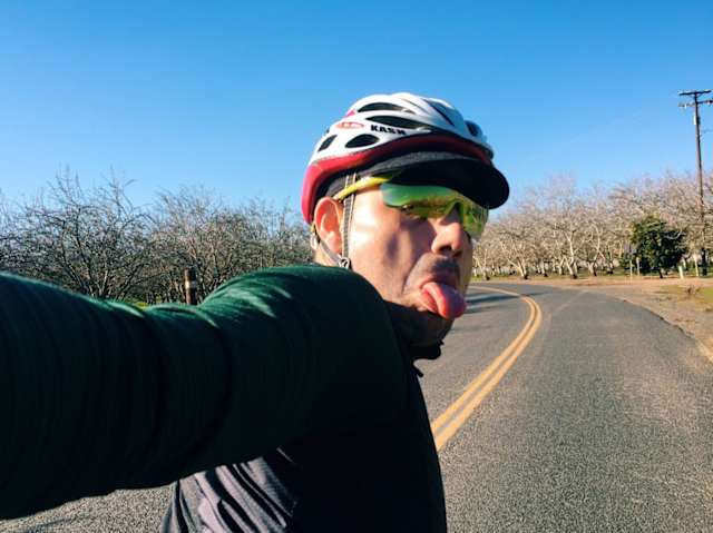 A selfie means you do it yourself, if someone else takes it - it isn't a selfie. Use the top volume button to take a picture instead of the actual camera button for more control.