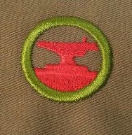 This badge, eliminated in 1952, required boys to "forge a chain hook out of 3/4 x 1/2-inch soft steel or 3/4-inch round iron." We're just assuming kids worked out more before 1952, I guess.