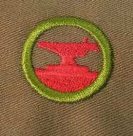 This badge, eliminated in 1952, required boys to "forge a chain hook out of 3/4 x 1/2-inch soft steel or 3/4-inch round iron." We're just assuming kids worked out more before 1952, I guess.