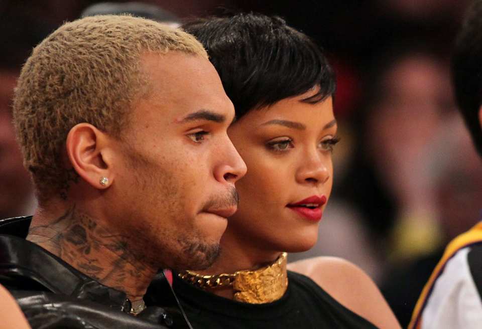 Chris Brown has a tattoo of a woman with a black eye on his neck.