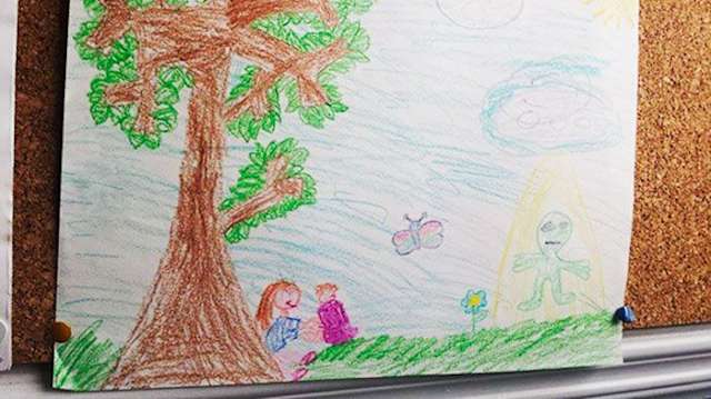 Here, we see a drawing one woman found of her sister offering her as an infant to visiting aliens.
