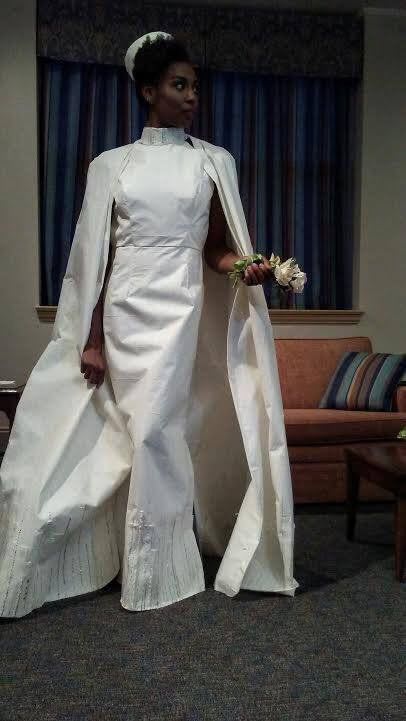This 60s-inspired gown was submitted by Susan Masarek Wilson and features a high neckline, a pillbox hat, and a full cape. Toilet paper or no, we have a feeling Jackie O would have felt right at home in this dress.