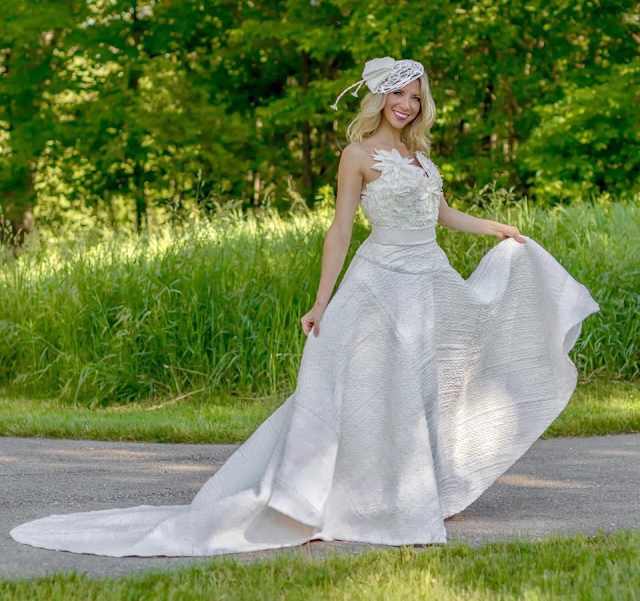Susan Brennan submitted this stunning toilet paper gown, with a surprisingly sturdy and thick quilted skirt. The added texture brings a beautiful richness to gown that is matched only by its floral neckline and matching birdcage veil.