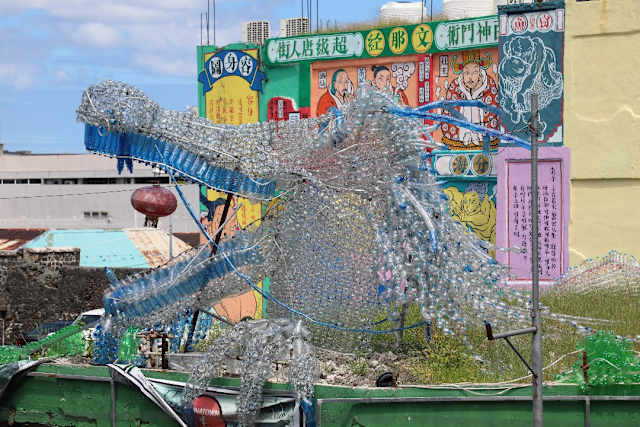 Dragon head made from plastic bottles that runs through out different buildings in China Town Port Louis, Mauritius