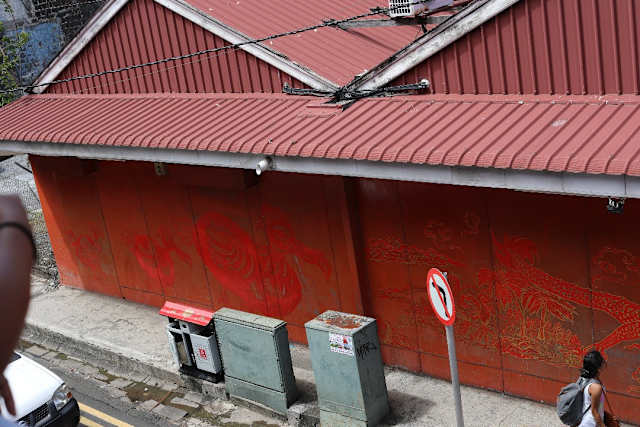 Dragon drawings on the side of buildings in China Town Port Louis, Mauritius