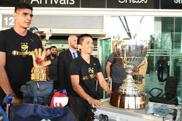 Gurpreet Singh was quick to take his golden glove award with him as they just walked out of the airport building