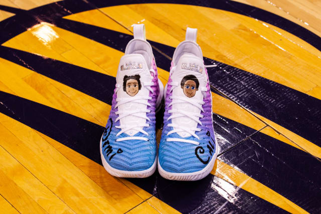 DeWanna Bonner’s twin daughters fueled her custom pair, with the names of both Demi and Cali seen along each toe -- in Disney font no less. The blue to purple gradient upper is contrasted by a white tongue, where caricatures of the girls' faces can be seen. Bonner’s young twins were on hand when she received her sneakers, which made for a family moment they’ll cherish for years.